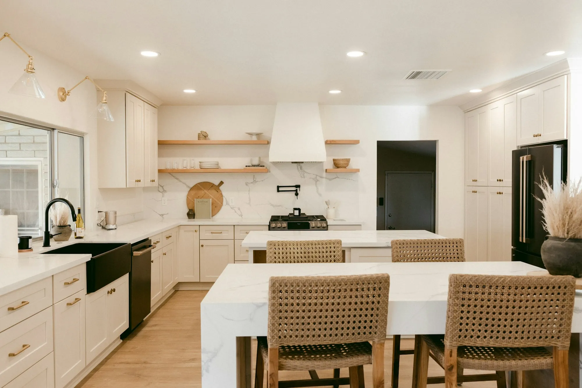 Bright open kitchen and dining room with new lighting